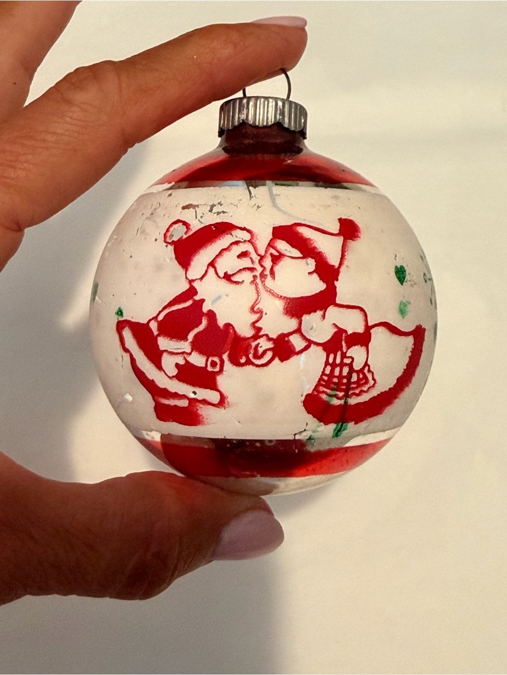 Vintage Santa and Mrs. Claus kissing ornament Holiday Glass